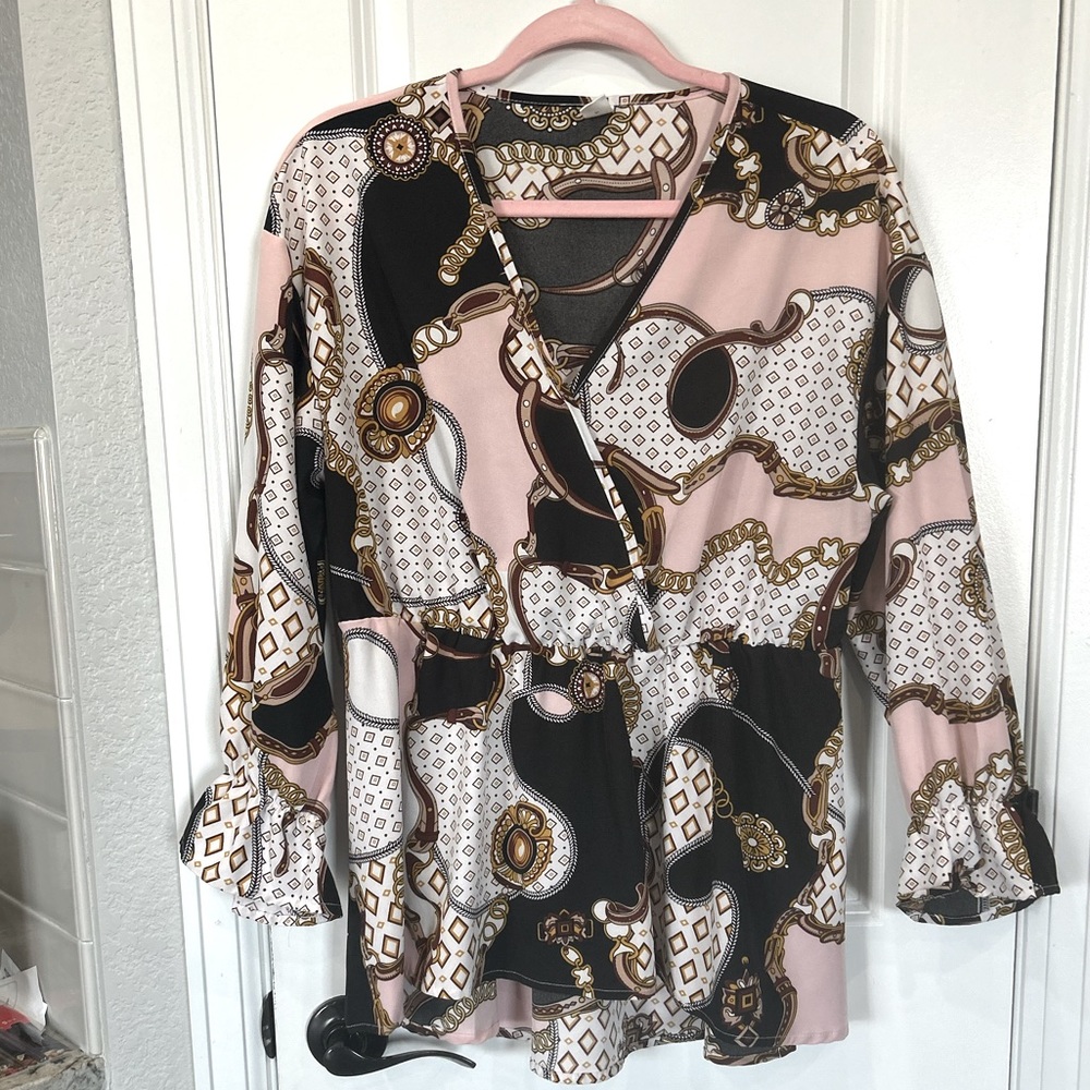Long peplum style top with poet sleeves